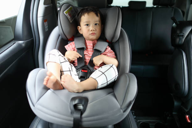 istock Happy boy is secure in a baby car seat 1216665080
