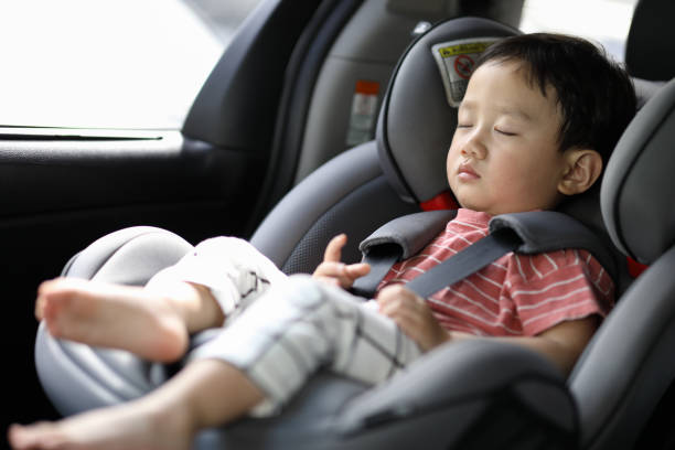 istock Happy boy is secure in a baby car seat 1216665108