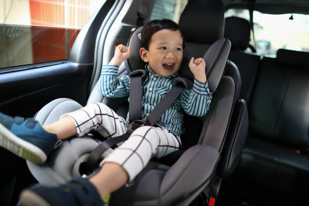 istock Happy boy is secure in a baby car seat 1216665213
