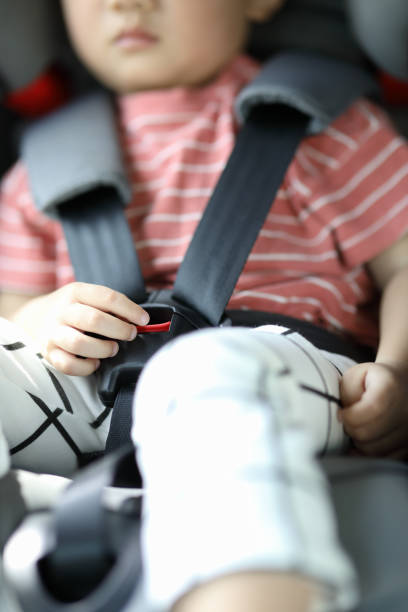 istock Happy boy is secure in a baby car seat 1216665224