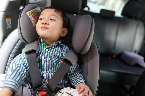 istock Happy boy is secure in a baby car seat 1216666004