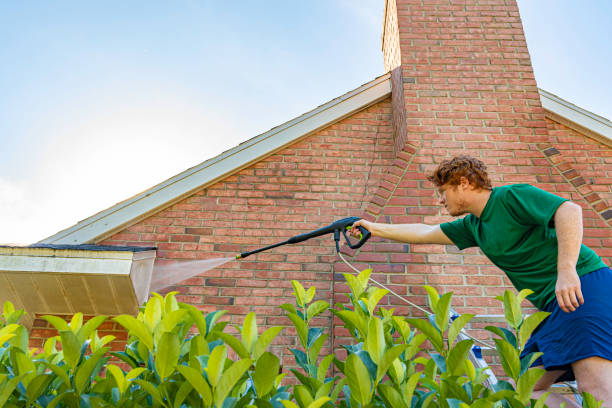 istock Pressure Washing a Brick House 1216666458