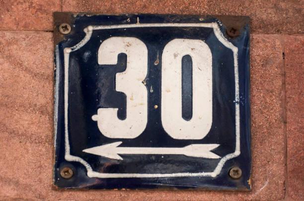 istock Weathered enameled plate number 30 1216668483