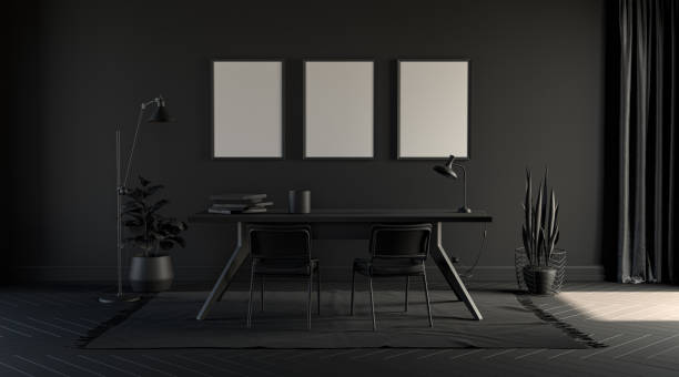istock Dark office in plain monochrome black color with working table, plants and floor lamp on a carpet. Dark background. 3D rendering 1216668674