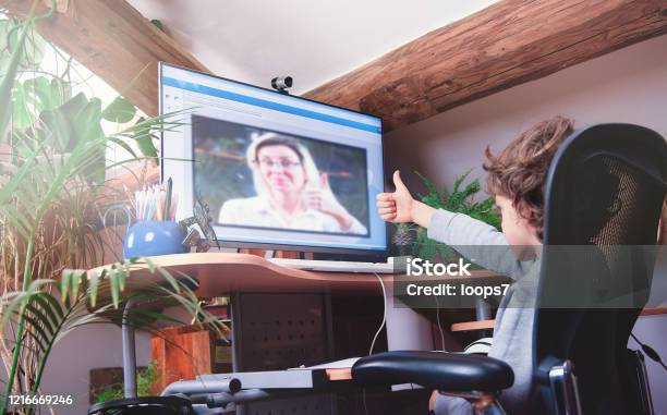 Child Studying Online Lesson At Home Stock Photo - Download Image Now - Remote Location, Learning, Teacher