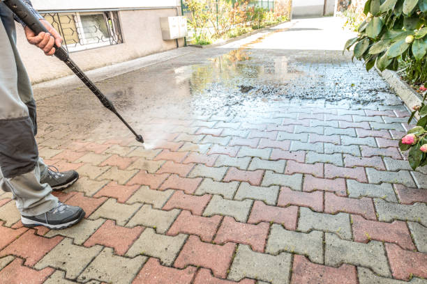 istock Active Senior Man Using High Pressure Washer to Clean the Entrance 1216670119