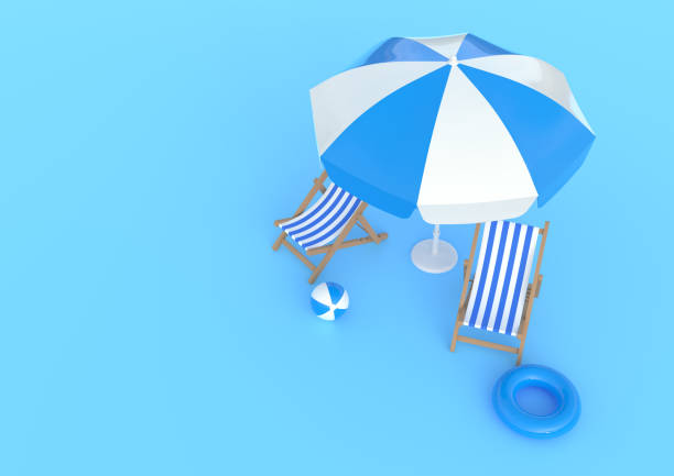 istock Beach umbrella with chairs and beach accessories on the bright blue background 1216672611