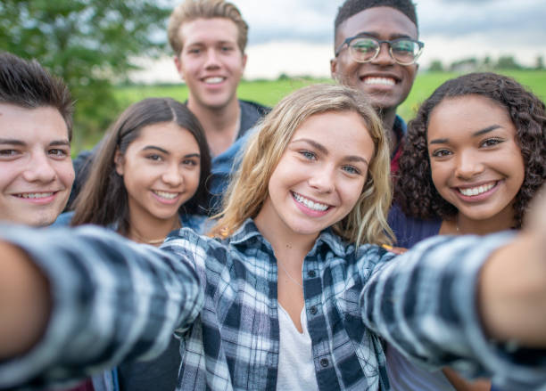 istock University Students Taking a Selfie stock photo 1216674104