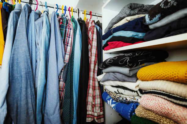 istock Closet with men's and women's clothes 1216674154