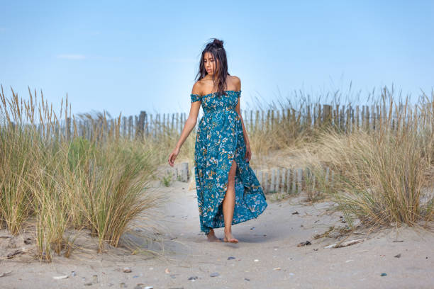 istock WOMAN ON THE SAND 1216674190