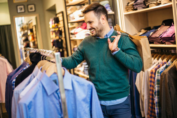 istock Handsome young male with shopping bags 1216674977