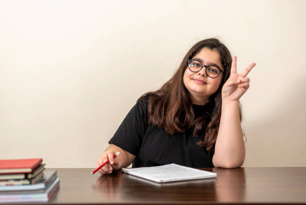 istock 13 years old girl doing homework 1216675908