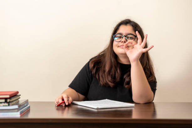istock 13 years old girl doing homework 1216675993