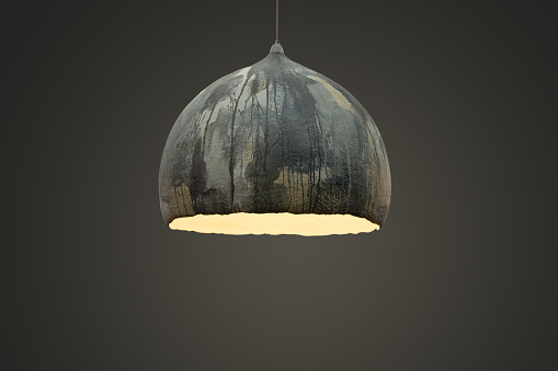 Gray chandelier with grunge texture, large ceiling, modern lamp design.