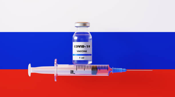 러시아 국기에 covid-19 백신 과 주사기 - russian shot 뉴스 사진 이미지