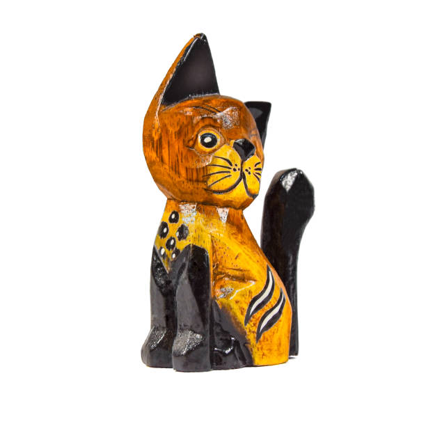 istock Vintage wooden cat figure isolated on white background 1216677563