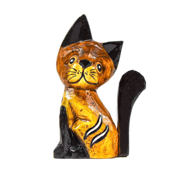 istock Vintage wooden cat figure isolated on white background 1216677624