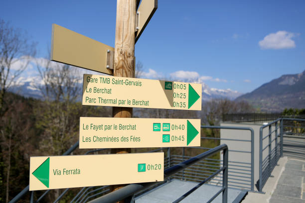 France. Auvergne-Rhône-Alpes. Haute-Savoie. Saint-Gervais-les-Bains. 03/04/2020. This colorful image depicts hiking signage: TMB Saint-Gervais station. Le Berchat. Thermal Park by the Berchat. Fayer by Berchat. The Chimneys of the Fairies. Via ferrata. French Alps. señales de senderismo: estación tmb saint-gervais. le berchat. parque termal por el berchat. fayer de berchat. las chimeneas de las hadas. vía ferrata. alpes franceses. saint-gervais-les-bains. alta saboya. auvernia-ródano-alpes. francia.