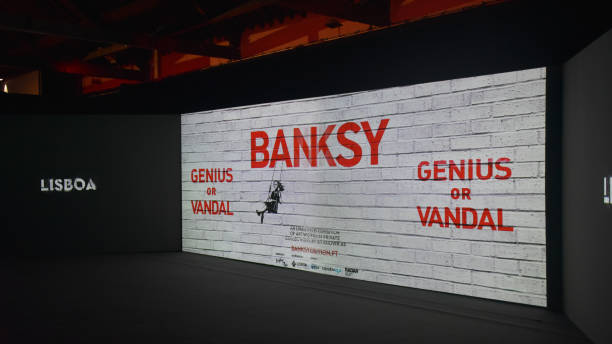 'Genius or Vandal' exhibition of works by the artist 'Banksy' at the Cordoaria Nacional, Lisbon, Portugal. 'Genius or Vandal' exhibition of works by the artist 'Banksy' at the Cordoaria Nacional art space in the city of Lisbon, Portugal. banksy stock pictures, royalty-free photos & images