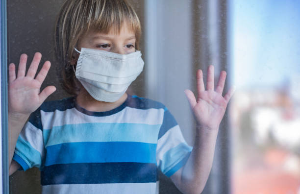 istock Closeup boy with surgical mask 1216679558