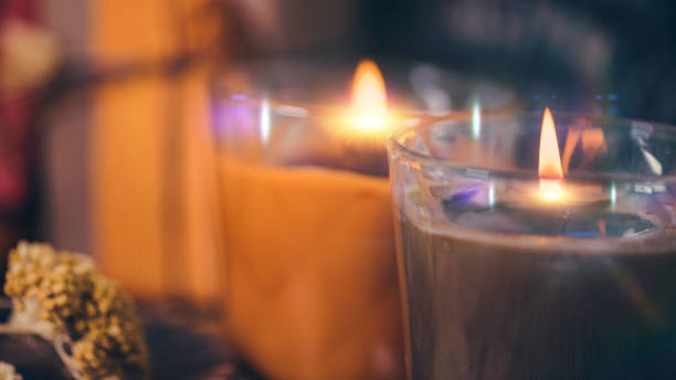 istock Scented Candles, Presents, Dried Flowers and Leaf Decoration on a Table 1216679580