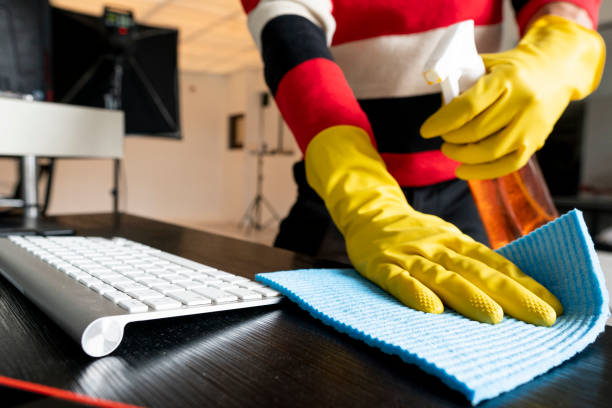 istock Covid-19 gloved hands cleaning a table 1216682734