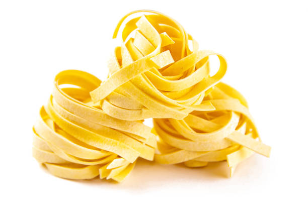 istock Row dry nest pasta on white bacground. Front views 1216683517
