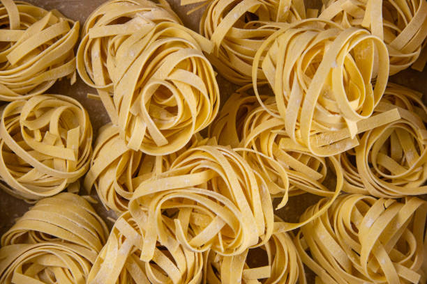 istock Pasta fettuccine background. Top views close-up 1216684922