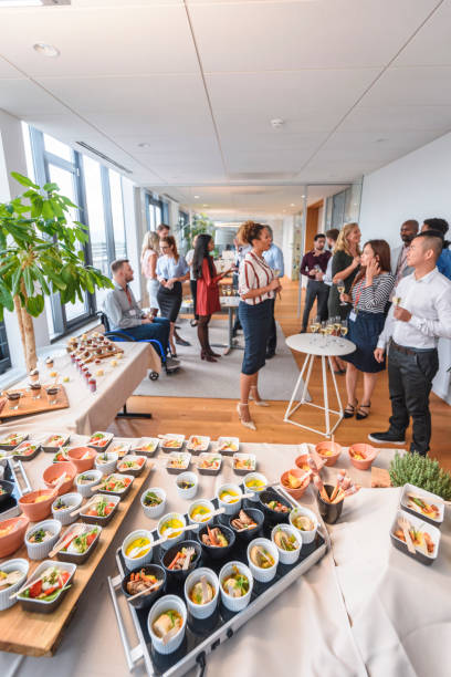 istock Savory Small Dishes and Colleagues Enjoying Office Party 1216687248