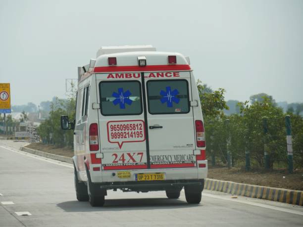 an ambulance vehicle travels along yamuna expressway. - new delhi horizontal photography color image imagens e fotografias de stock