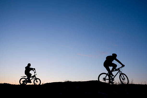 istock Silhouette of two bikers 121669276