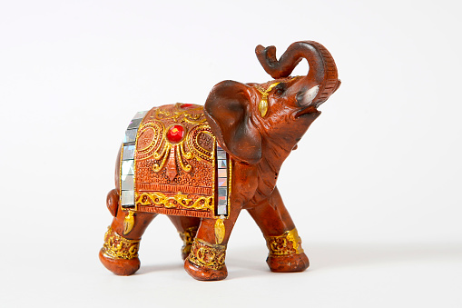 decorative elephant doll, isolated  on white background
