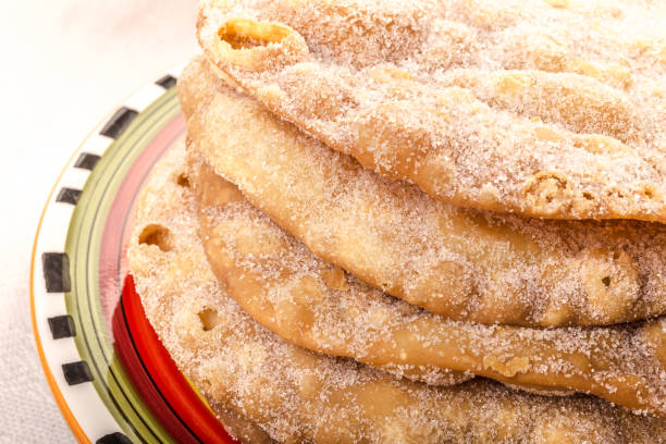 istock Mexican fritters, sweet dish made from fried flour dough c 1216699180