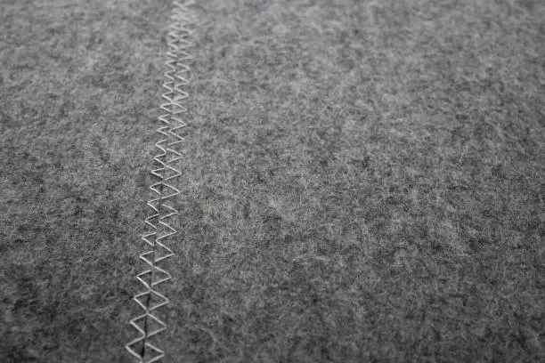 Two grey felt placemats side by side.