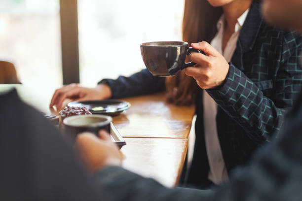 istock people enjoyed talking and drinking coffee together in cafe 1216705908