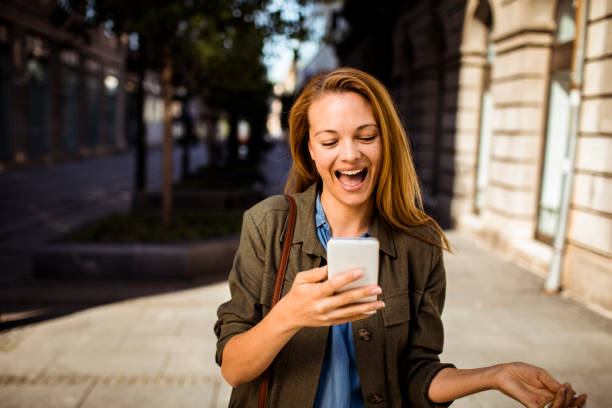istock Young Lady shopping and using a Phone 1216706465