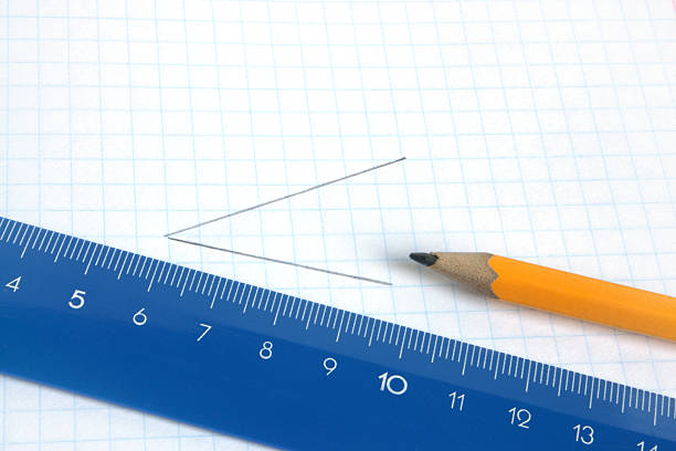 istock Pencil and ruler on a school writing-book 121670711