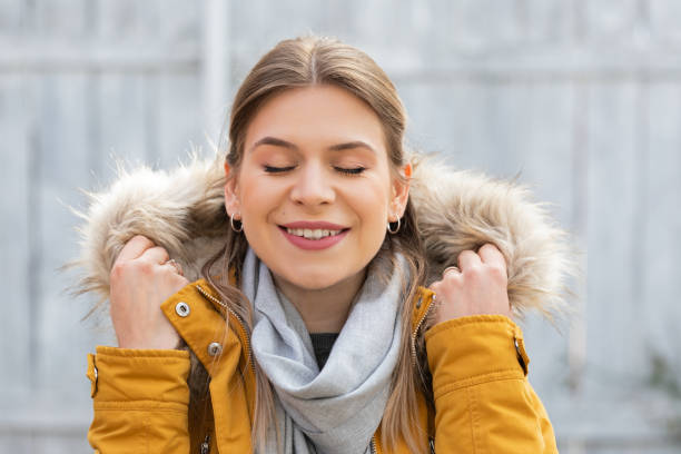 istock Attractive woman with yellow jacket 1216709810