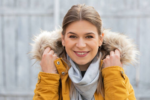 istock Attractive woman with yellow jacket 1216709829