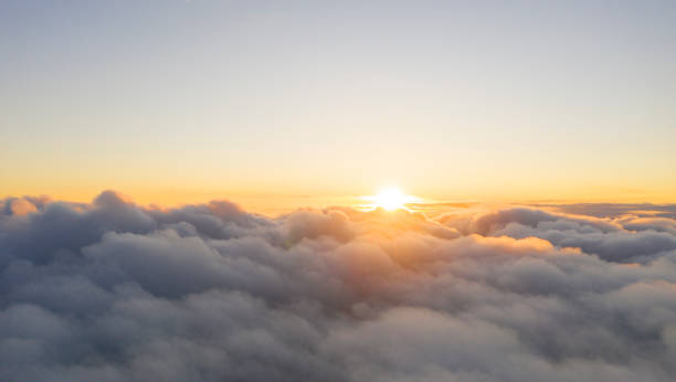 istock Aerial view White clouds in blue sky. View from drone. Aerial top view cloudscape. Texture of clouds. View from above. Sunrise or sunset over clouds. Panorama clouds 1216714115