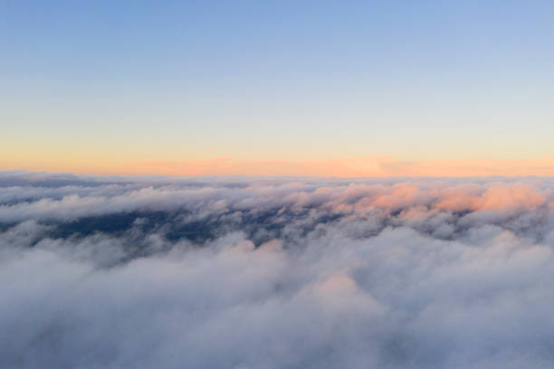 istock Aerial view White clouds in blue sky. View from drone. Aerial top view cloudscape. Texture of clouds. View from above. Sunrise or sunset over clouds. Panorama clouds 1216714140