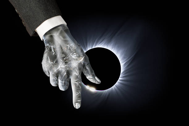 Businessman cyborg points to the future.The background is a solar eclipse and solar corona.