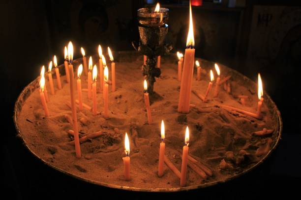 istock Lighting candles inside a Greek orthodox church. 1216716886