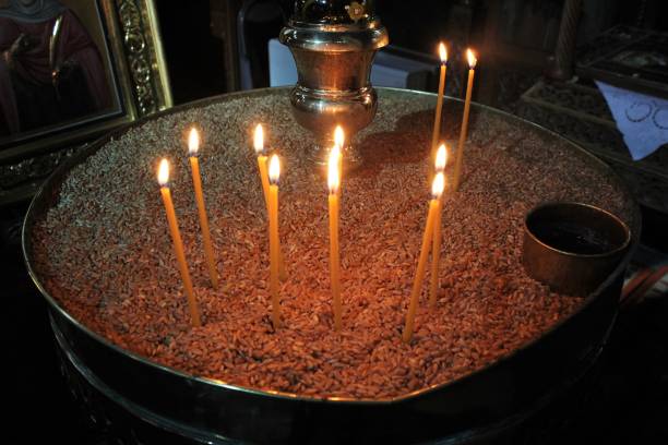 istock Lighting candles inside a Greek orthodox church. 1216716903