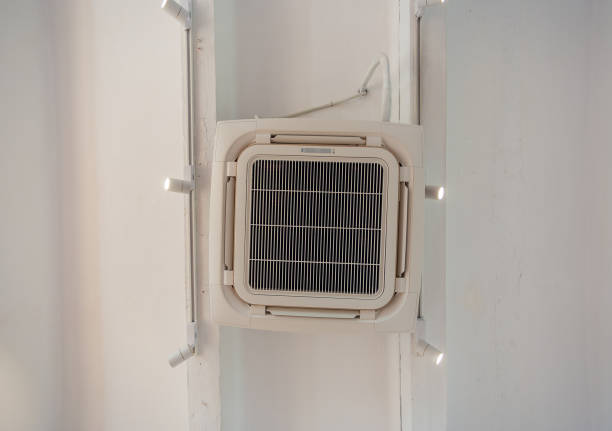 istock Cassette type ceiling air conditioner on white ceiling grunge style 1216719924