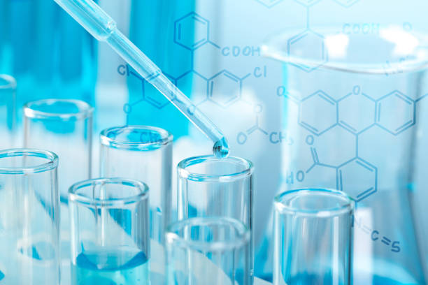 istock Laboratory glassware with a dropper dripping liquid into a test tube. scientific laboratory test tubes, laboratory equipment 1216719985