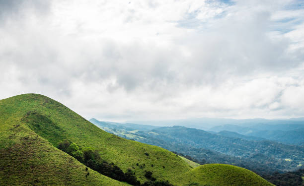istock mountain with green grass and beautiful sky 1216720974