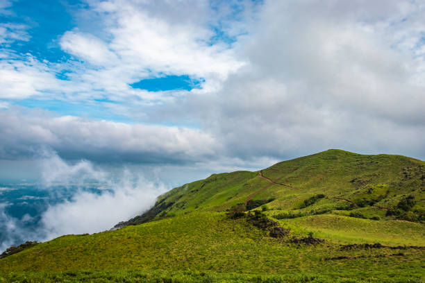 istock mountain with green grass and beautiful sky 1216721271