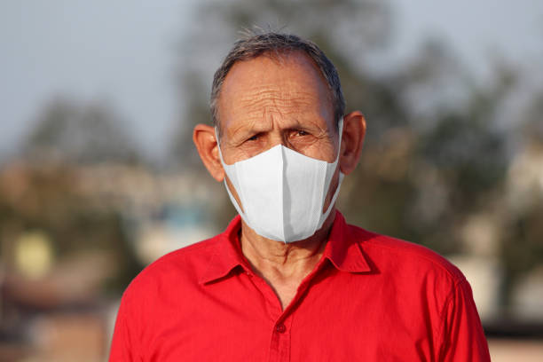 istock Senior men covering his face with pollution mask for protection from viruses 1216722091