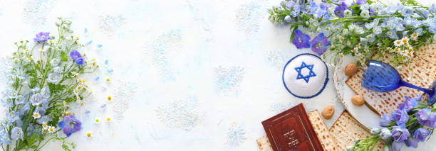 istock Pesah celebration concept (jewish Passover holiday). Traditional book with text in hebrew: Passover Haggadah (Passover Tale) 1216723000